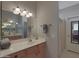 Bathroom featuring a large mirror, decorative lighting, and a tiled floor at 2416 N Snead Dr, Mesa, AZ 85215