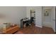 The bedroom offers hardwood floors and a desk with a walk-in closet at 2416 N Snead Dr, Mesa, AZ 85215