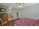 Comfortable bedroom featuring hardwood floors and a ceiling fan for optimal climate control at 2416 N Snead Dr, Mesa, AZ 85215
