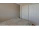 Bedroom with a sliding closet door and a patterned bedspread at 2416 N Snead Dr, Mesa, AZ 85215