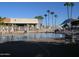 Relaxing pool area with lounge chairs and tables offers poolside leisure at 2416 N Snead Dr, Mesa, AZ 85215