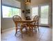 Bright dining room featuring tile flooring, windows, and a door to the outdoor patio at 2416 N Snead Dr, Mesa, AZ 85215