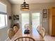 Dining area featuring wood table and chairs, pendant light, and windows with natural light at 2416 N Snead Dr, Mesa, AZ 85215
