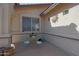 Cozy front patio featuring a small round table with chairs, perfect for relaxing outdoors in a private space at 2416 N Snead Dr, Mesa, AZ 85215