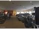 Spacious gym with state-of-the-art fitness equipment, including treadmills, stationary bikes, and weight machines at 2416 N Snead Dr, Mesa, AZ 85215