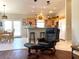 Bright kitchen with breakfast bar, stools, stainless refrigerator, and dining table in background at 2416 N Snead Dr, Mesa, AZ 85215