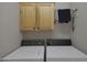 Practical laundry area with side-by-side washer and dryer at 2416 N Snead Dr, Mesa, AZ 85215