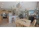 Open concept kitchen, dining room and living room create a versatile living space with lots of natural light at 2416 N Snead Dr, Mesa, AZ 85215