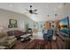 Open concept living space showcases the kitchen, dining area and living room with lots of natural light at 2416 N Snead Dr, Mesa, AZ 85215