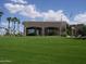 A single-story clubhouse, the pro shop is adjacent to the golf course at 2416 N Snead Dr, Mesa, AZ 85215