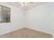 Bedroom with a ceiling fan, carpet, and a window at 2454 E Vermont Dr, Gilbert, AZ 85295