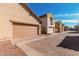 Exterior view of the home's garage and façade featuring a driveway paved with decorative brick at 2454 E Vermont Dr, Gilbert, AZ 85295