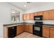 Functional kitchen with black appliances and ample cabinet space at 2454 E Vermont Dr, Gilbert, AZ 85295