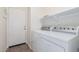 A laundry room with a modern washer and dryer at 2454 E Vermont Dr, Gilbert, AZ 85295
