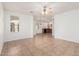 Open-concept room with tile flooring, ceiling fan, and sight lines into kitchen at 2454 E Vermont Dr, Gilbert, AZ 85295