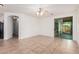 Open-concept room with tiled floors, ceiling fan, and easy access to patio at 2454 E Vermont Dr, Gilbert, AZ 85295