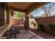 Covered patio with decorative stone pillar, concrete flooring, and views of the landscaped backyard at 2454 E Vermont Dr, Gilbert, AZ 85295