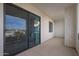 Spacious balcony features sliding glass doors and a textured stucco wall at 2511 W Queen Creek Rd # 307, Chandler, AZ 85248