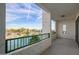 Balcony overlooking a picturesque community lake with a fountain and palm trees at 2511 W Queen Creek Rd # 307, Chandler, AZ 85248
