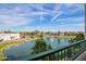 Scenic balcony view of a community lake with a fountain on a sunny day at 2511 W Queen Creek Rd # 307, Chandler, AZ 85248