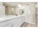 Bathroom vanity with double sinks, modern fixtures, and a large mirror at 2511 W Queen Creek Rd # 307, Chandler, AZ 85248