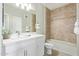 Bright bathroom featuring a shower-tub combo, tiled floors, and modern fixtures at 2511 W Queen Creek Rd # 307, Chandler, AZ 85248