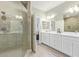 Bright bathroom with a double vanity, walk-in shower, and modern fixtures at 2511 W Queen Creek Rd # 307, Chandler, AZ 85248