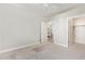 Neutral bedroom features carpet and a connecting view to the dining room at 2511 W Queen Creek Rd # 307, Chandler, AZ 85248