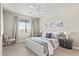 Primary bedroom features a ceiling fan, window with blinds, and carpet flooring at 2511 W Queen Creek Rd # 307, Chandler, AZ 85248