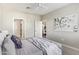 The bedroom features an ensuite bathroom, ceiling fan, and carpet flooring at 2511 W Queen Creek Rd # 307, Chandler, AZ 85248