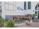 Exterior building view with a pond, waterfall feature, landscaping, and 