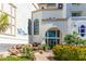 Beautifully landscaped entrance to the clubhouse, featuring a waterfall feature and colorful plantings at 2511 W Queen Creek Rd # 307, Chandler, AZ 85248