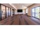 The community room is a spacious area with large windows and a tv that can be used for many purposes at 2511 W Queen Creek Rd # 307, Chandler, AZ 85248