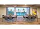 Open community room with views of the pool, featuring tables for meetings and community gatherings at 2511 W Queen Creek Rd # 307, Chandler, AZ 85248