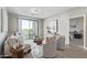 Bright living room with modern furnishings, balcony access, and stylish decor elements at 2511 W Queen Creek Rd # 307, Chandler, AZ 85248