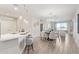 Bright living room with modern fixtures, breakfast bar, and dining area at 2511 W Queen Creek Rd # 307, Chandler, AZ 85248