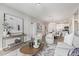 Spacious living room with elegant decor, plush seating, and an open concept design at 2511 W Queen Creek Rd # 307, Chandler, AZ 85248