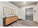 Elegant lobby featuring modern console table, artwork, and convenient elevator access at 2511 W Queen Creek Rd # 307, Chandler, AZ 85248