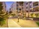 Lovely outdoor area with tables, chairs, barbecue grills, and mature trees at 2511 W Queen Creek Rd # 307, Chandler, AZ 85248