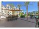 The outdoor community patio offers seating and BBQ area, perfect for entertaining guests or enjoying a relaxing afternoon at 2511 W Queen Creek Rd # 307, Chandler, AZ 85248