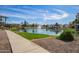 Scenic view of a pond featuring a fountain with upscale residential buildings in the background at 2511 W Queen Creek Rd # 307, Chandler, AZ 85248