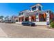 Charming street view showcasing the stylish architecture, with a blue car parked outside the building at 2511 W Queen Creek Rd # 307, Chandler, AZ 85248