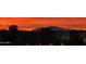 Scenic sunset view with silhouette of a distant mountain in the background at 2511 W Queen Creek Rd # 307, Chandler, AZ 85248