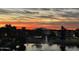 Breathtaking sunset reflecting over a lake with fountain, buildings, and vibrant sky at 2511 W Queen Creek Rd # 307, Chandler, AZ 85248
