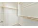 Walk-in closet with rod and shelves for easy organization at 2511 W Queen Creek Rd # 307, Chandler, AZ 85248