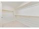 Spacious walk-in closet with ample shelving for storage at 2511 W Queen Creek Rd # 307, Chandler, AZ 85248