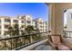 Balcony view of building with palm trees and beautiful clear sky background at 2511 W Queen Creek Rd # 323, Chandler, AZ 85248