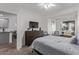 Relaxing bedroom featuring a comfortable bed, large TV, and cozy seating area at 2511 W Queen Creek Rd # 323, Chandler, AZ 85248