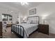 Serene bedroom with a comfortable bed, soft lighting, and a cozy seating area at 2511 W Queen Creek Rd # 323, Chandler, AZ 85248