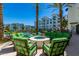 Outdoor fire pit lounge area with comfortable seating and views of the pool and palm trees at 2511 W Queen Creek Rd # 323, Chandler, AZ 85248